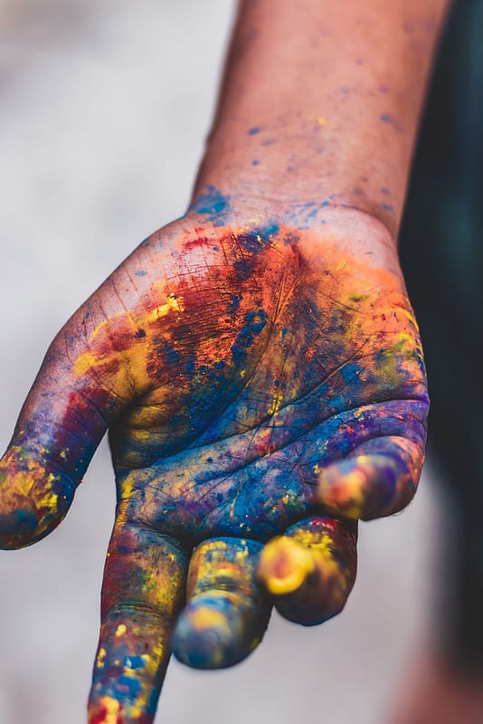 photo-of-person-s-hand-with-paint-colors